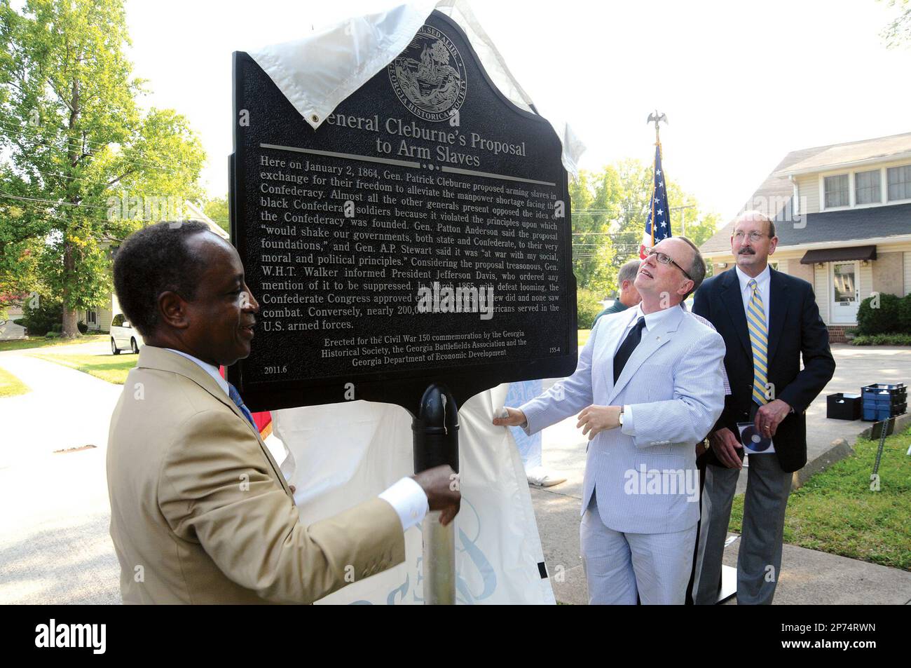 Michael Thurmond, left, and Dr. W. Todd Groce reveal the Historical Marker  at the Cook-Huff House in Dalton, Ga. titled 