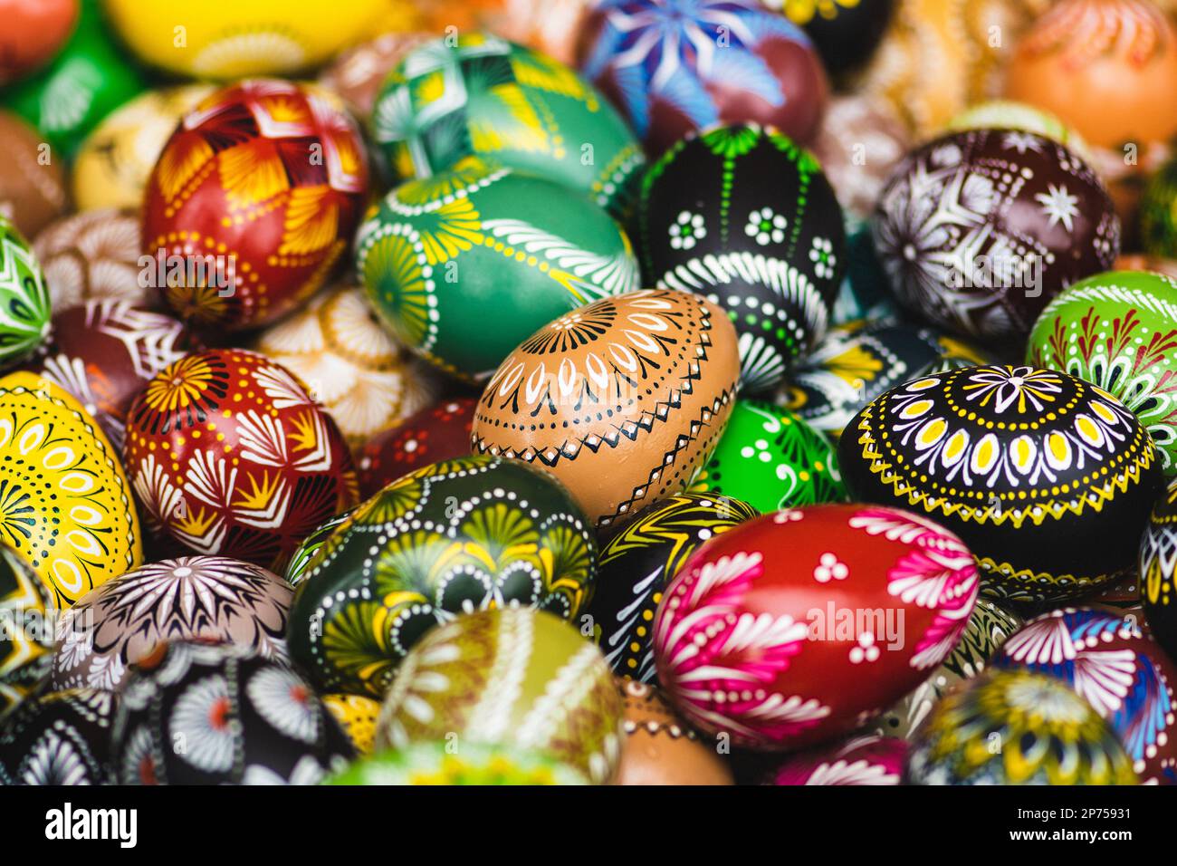 Traditional Lithuanian wooden colorful Easter eggs in a wicker basket