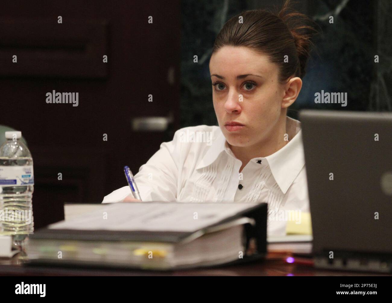 Casey Anthony sits at the defense table during a break in court during