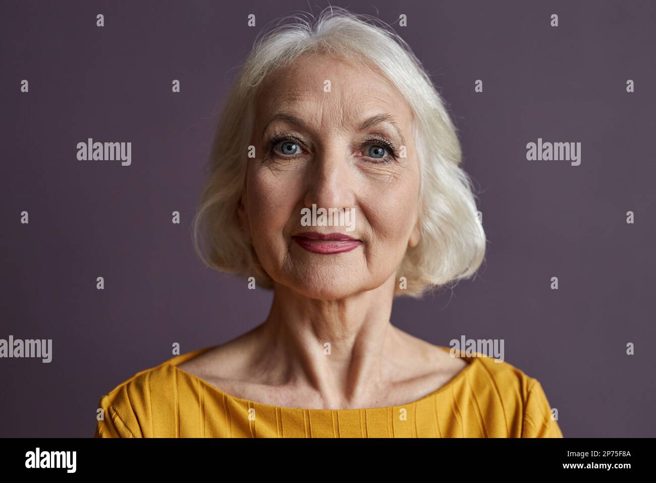Elderly senior woman wearing purple hi-res stock photography and images ...