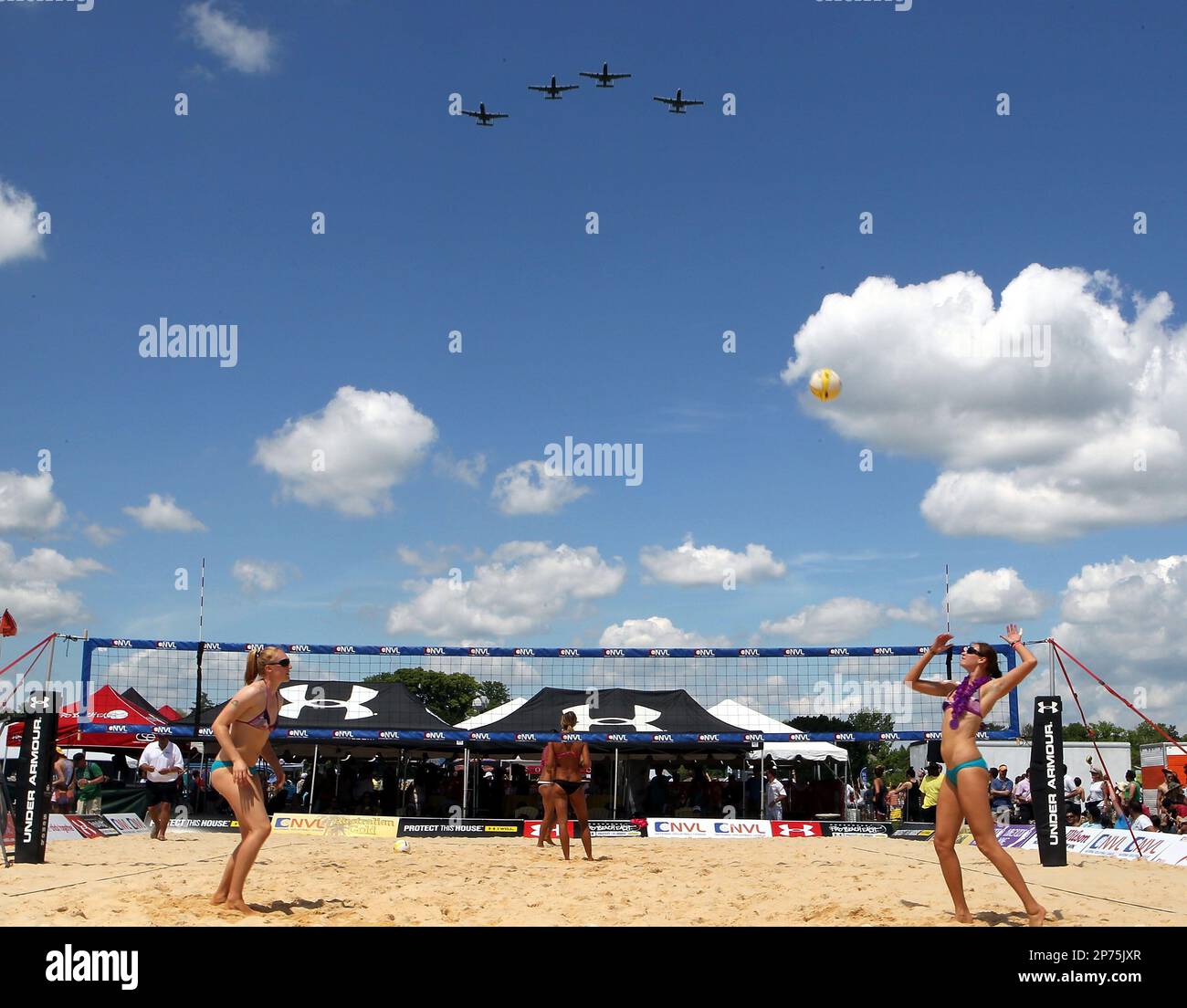 BALTIMORE, MD MAY 21 Pro Beach Volleyball players practice with a