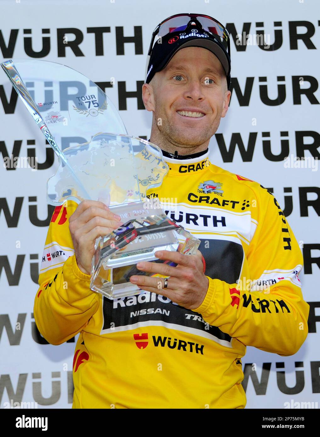 US's Levi Leipheimer of Team RadioShack celebrates on the podium with the  trophy after a 32,1 km race against the clock during the nineth and final  stage from Schaffhausen to Schaffhausen, at