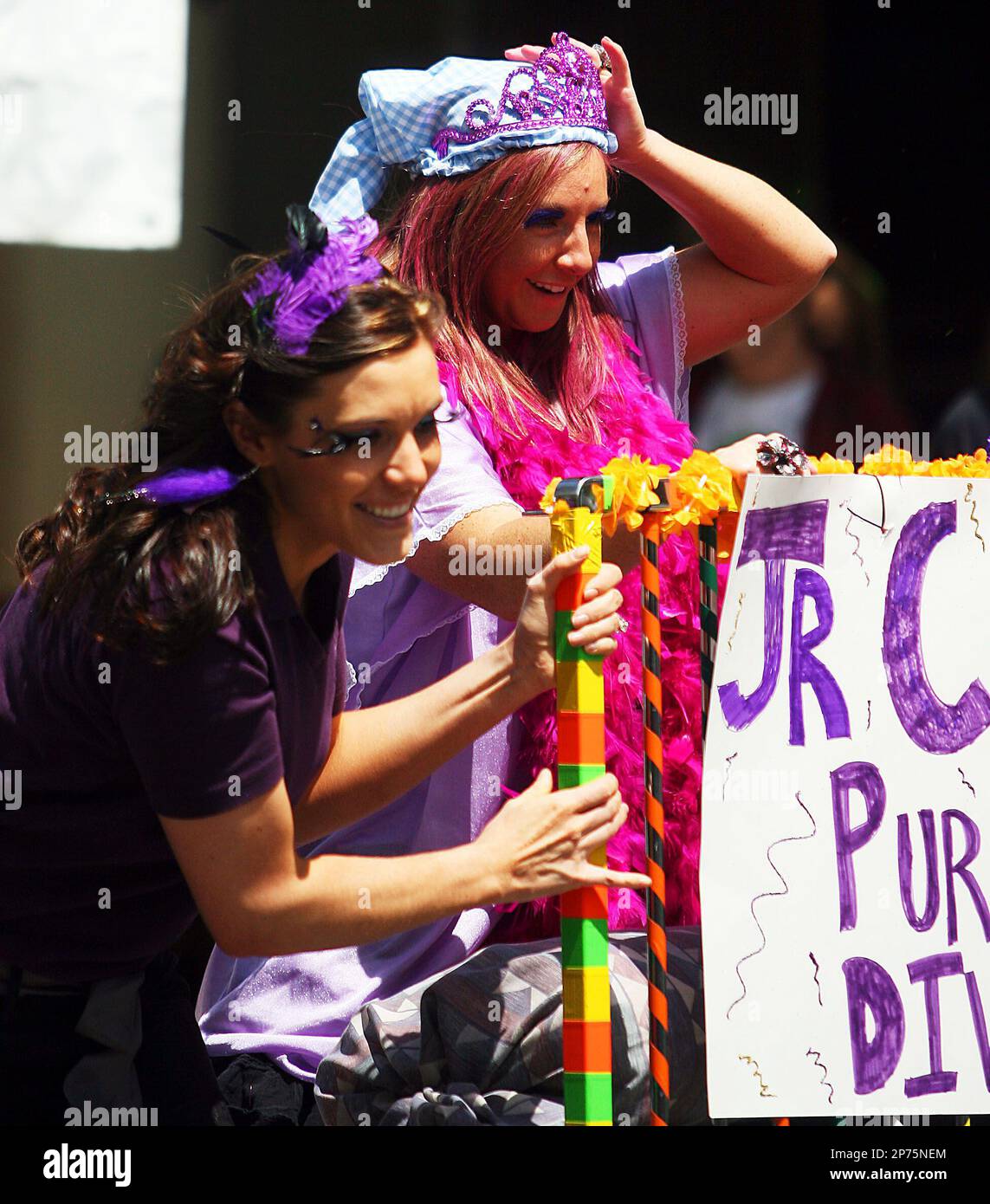 Courtney Burgoyne, right and teammate Amanda Dastrup participate in the