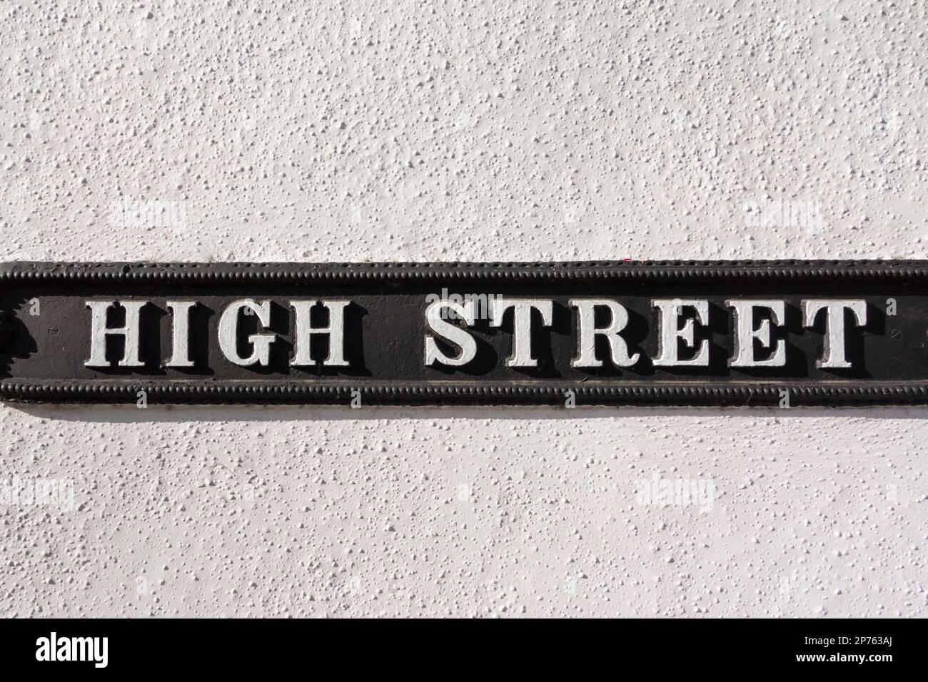 High Street sign on white wall, UK Stock Photo