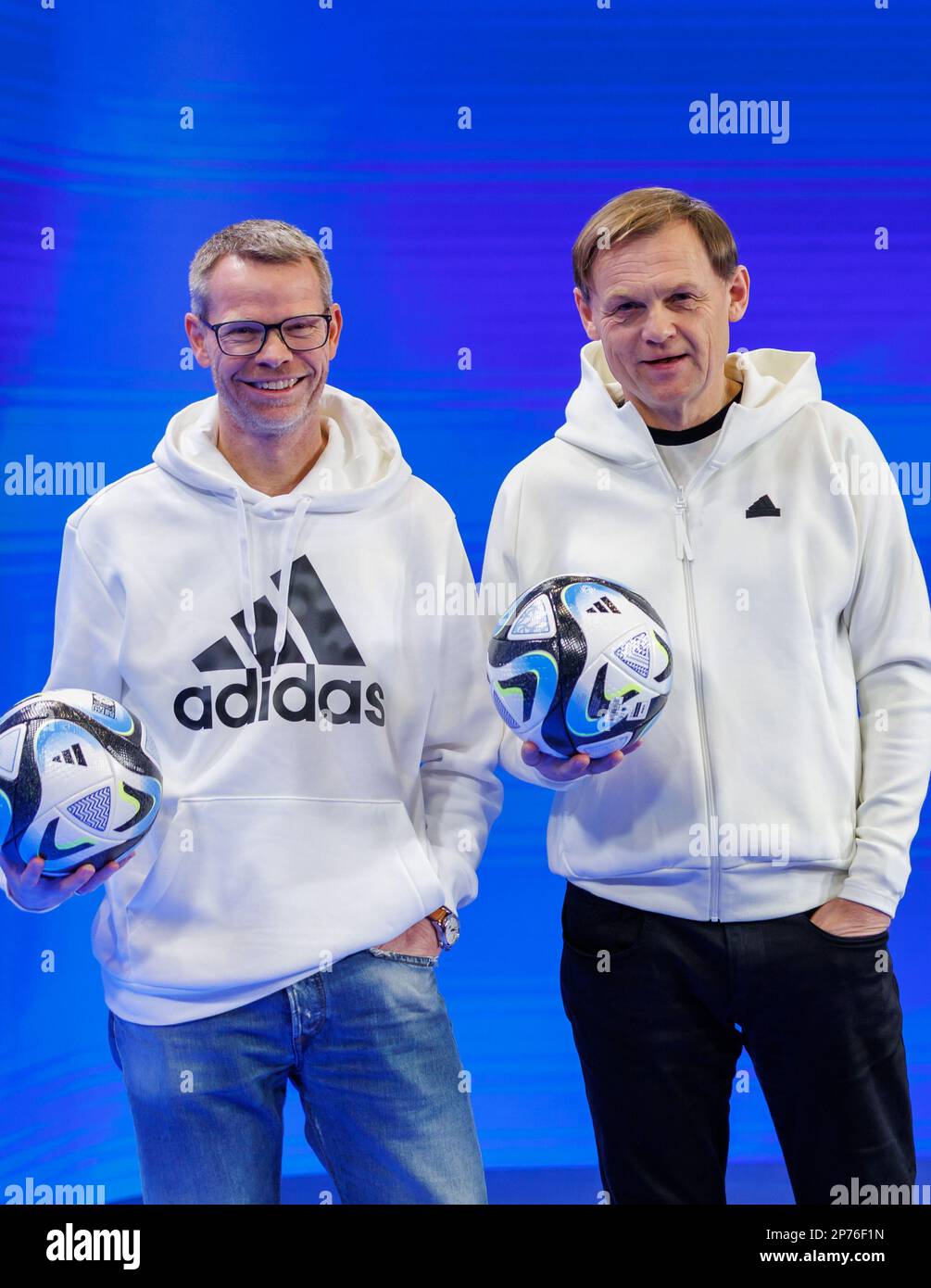 Herzogenaurach, Germany. 08th Mar, 2023. Harm Ohlmeyer (l), CFO of sporting  goods manufacturer adidas AG, and Björn Gulden, CEO of adidas, hold the  official match ball "OCEAUNZ" of the Women's World Cup