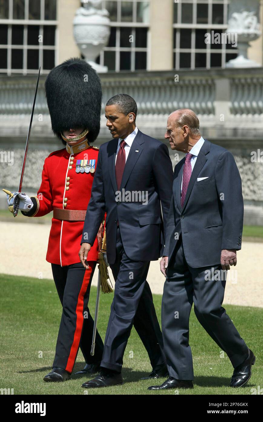 US President Barack Obama, center, prepares to inspect the guard of honor 1st battalion Scots Guards with Britain's Prince Philip, right, at Buckingham Palace in London, on Tuesday May 24, 2011. President Barack Obama and first lady Michelle Obama traded-in Irish charm for the pomp and pageantry of Buckingham Palace Tuesday as they opened a two-day state visit to Britain at the invitation of Queen Elizabeth II. (AP Photo/Adrian Dennis, Pool) Stock Photo