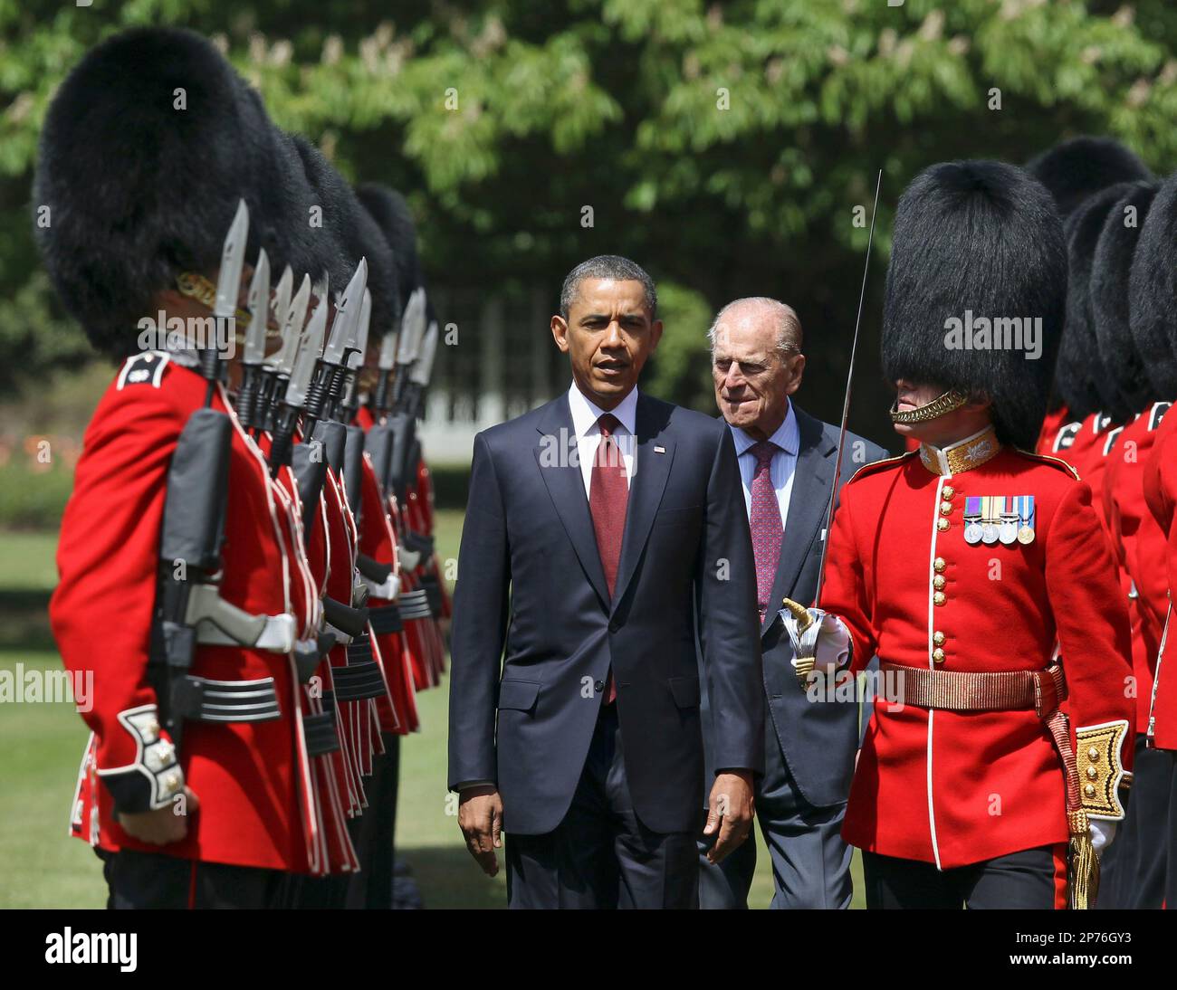 US President Barack Obama, center left, inspects the guard of honor 1st battalion Scots Guards with Britain's Prince Philip, center right, at Buckingham Palace in London, on Tuesday May 24, 2011. President Barack Obama and first lady Michelle Obama traded-in Irish charm for the pomp and pageantry of Buckingham Palace Tuesday as they opened a two-day state visit to Britain at the invitation of Queen Elizabeth II. (AP Photo/Adrian Dennis, Pool) Stock Photo