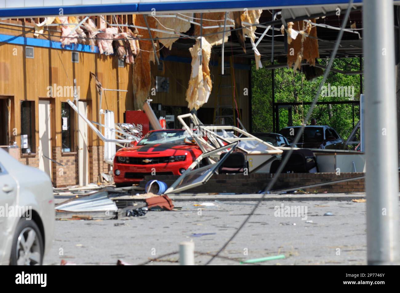 A Chevrolet Camaro sits in the wrecked showroom at the Walter Jackson dealership in Ringgold, Ga