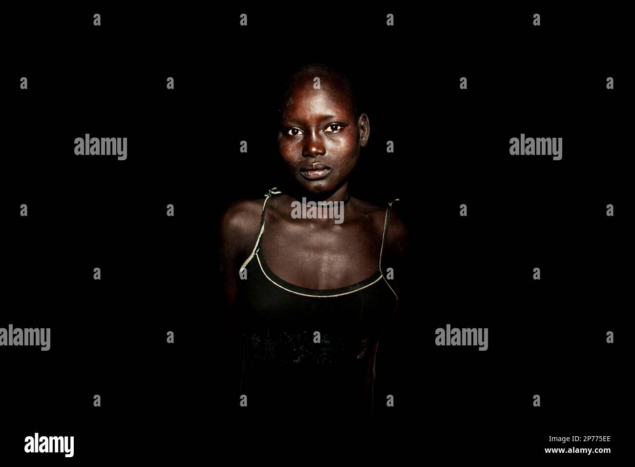 In this Thursday, April 21, 2011 photo, a young girl from the Dinka Rek ...