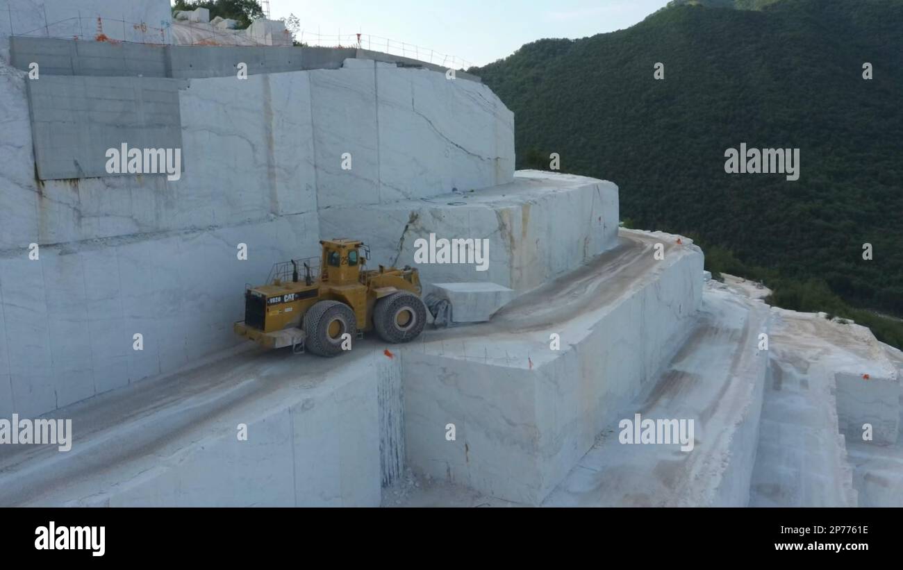 Wheel loader working at a huge marble quarry in Europe. Transporting