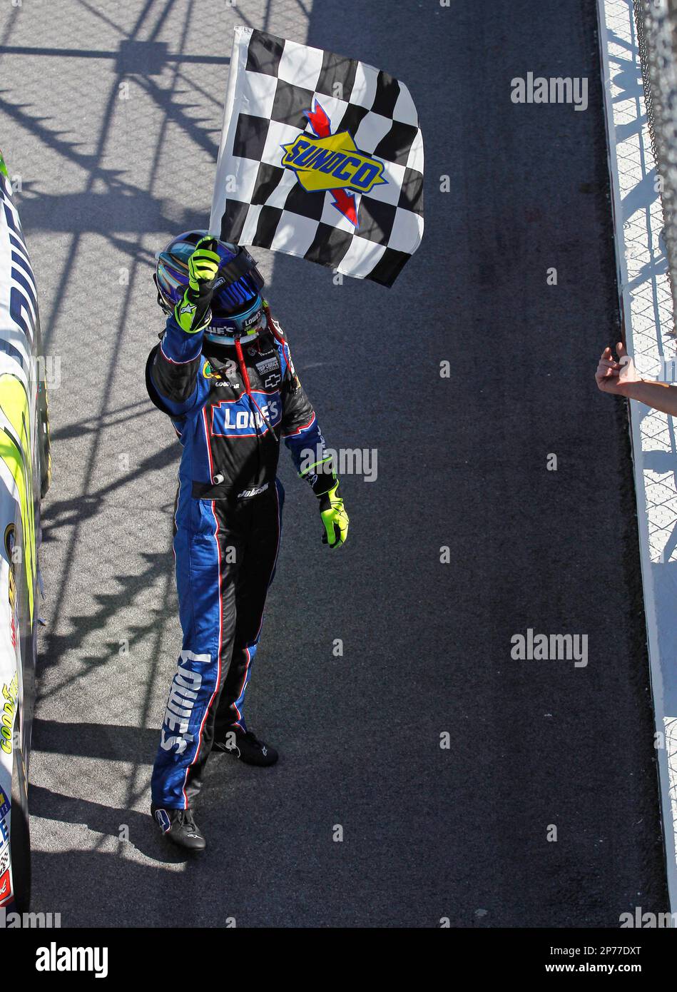 Jimmie Johnson, driver of the Lowe's Chevrolet, takes a victory lap,... Fotograf