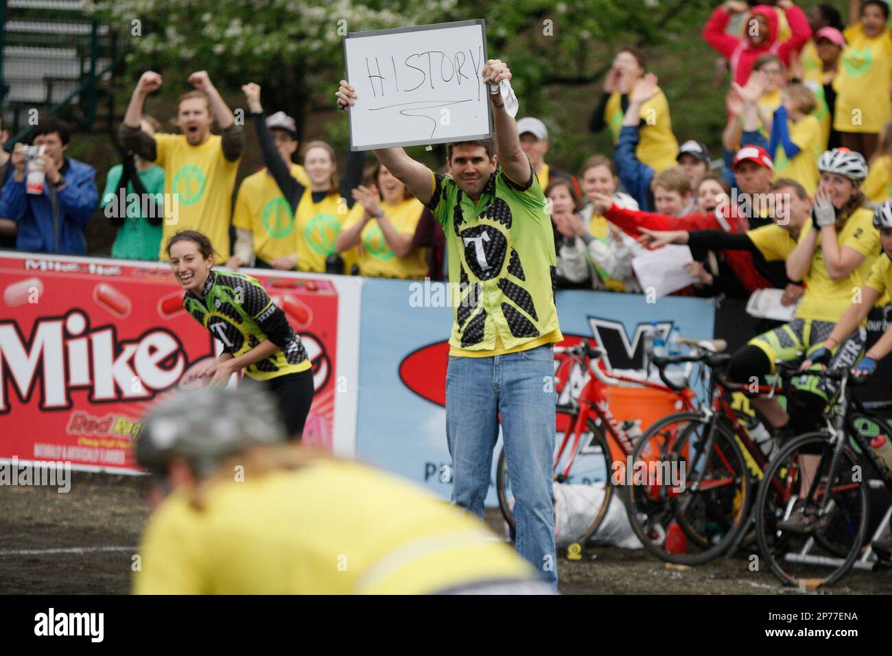 April 15, 2011: Teter Cycling coach holds up a sign with the word ...