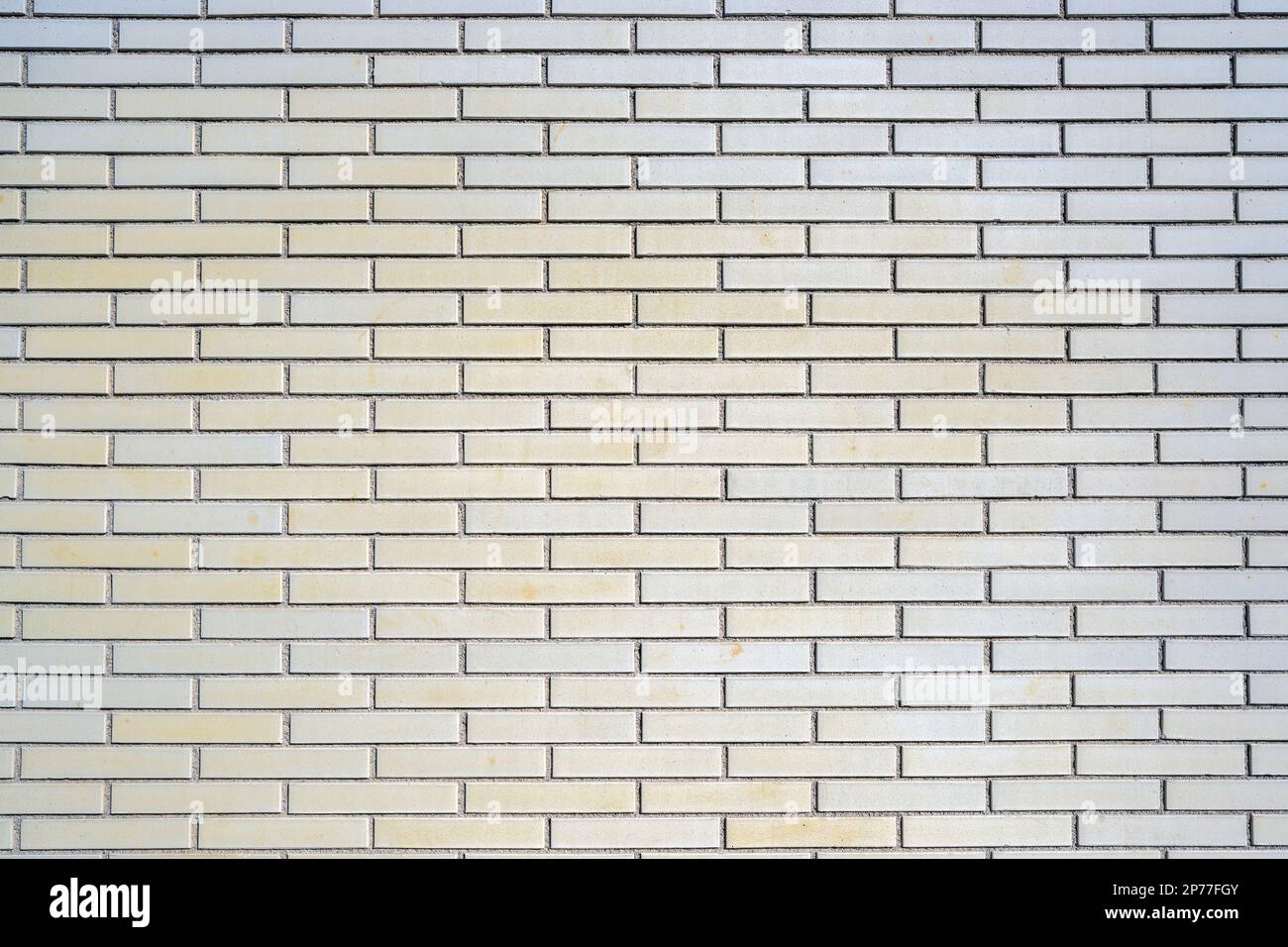 Background from a beige clinkered wall Stock Photo