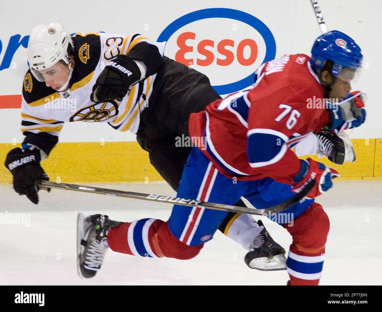 FILE - In this Dec. 16, 2010, file photo, Montreal Canadiens' P.K. Subban, right, collides with Boston Bruins' Brad Marchand during an NHL hockey game in Montreal. If there was one Montreal Canadien who got under the Boston Bruins' skin this season, it was Subban. So the rookie defenseman, who is chatty both on and off the ice, will be a likely target for the Bruins when they bring their physical style to the 33rd postseason matchup between the Original Six clubs. (AP Photo/The Canadian Press, Graham Hughes, File) Stock Photo