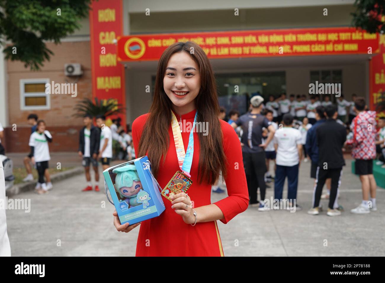 Bac Ninh. 8th Mar, 2023. A young woman poses for a photo with Hangzhou