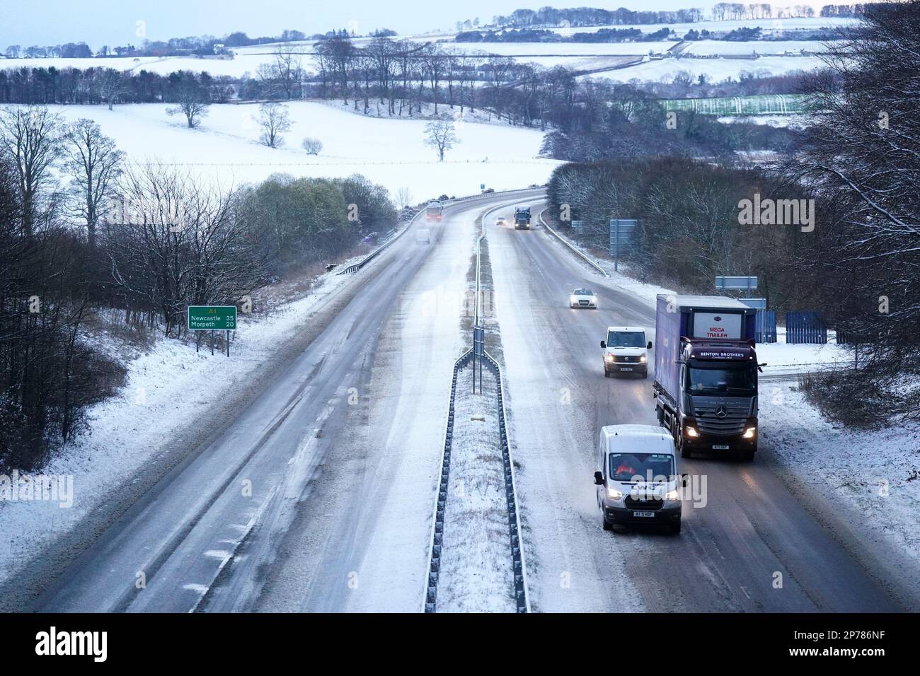 Handout photo of a snowy motorway, as drivers are advised to take ...