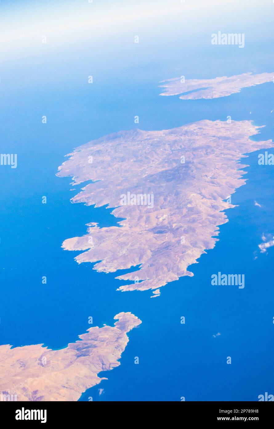 Andros,Tinos and Mikonos islands seen from flying airplane to Santorini.Greek islands in the Cyclades group in the Aegean Sea. September 2013 Stock Photo