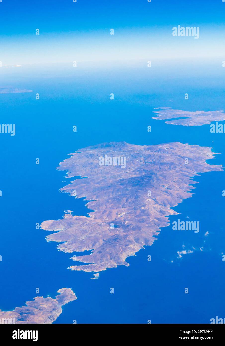 Andros,Tinos and Mykonos islands seen from flying airplane to Santorini.Greek islands in the Cyclades group in the Aegean Sea. September 2013 Stock Photo
