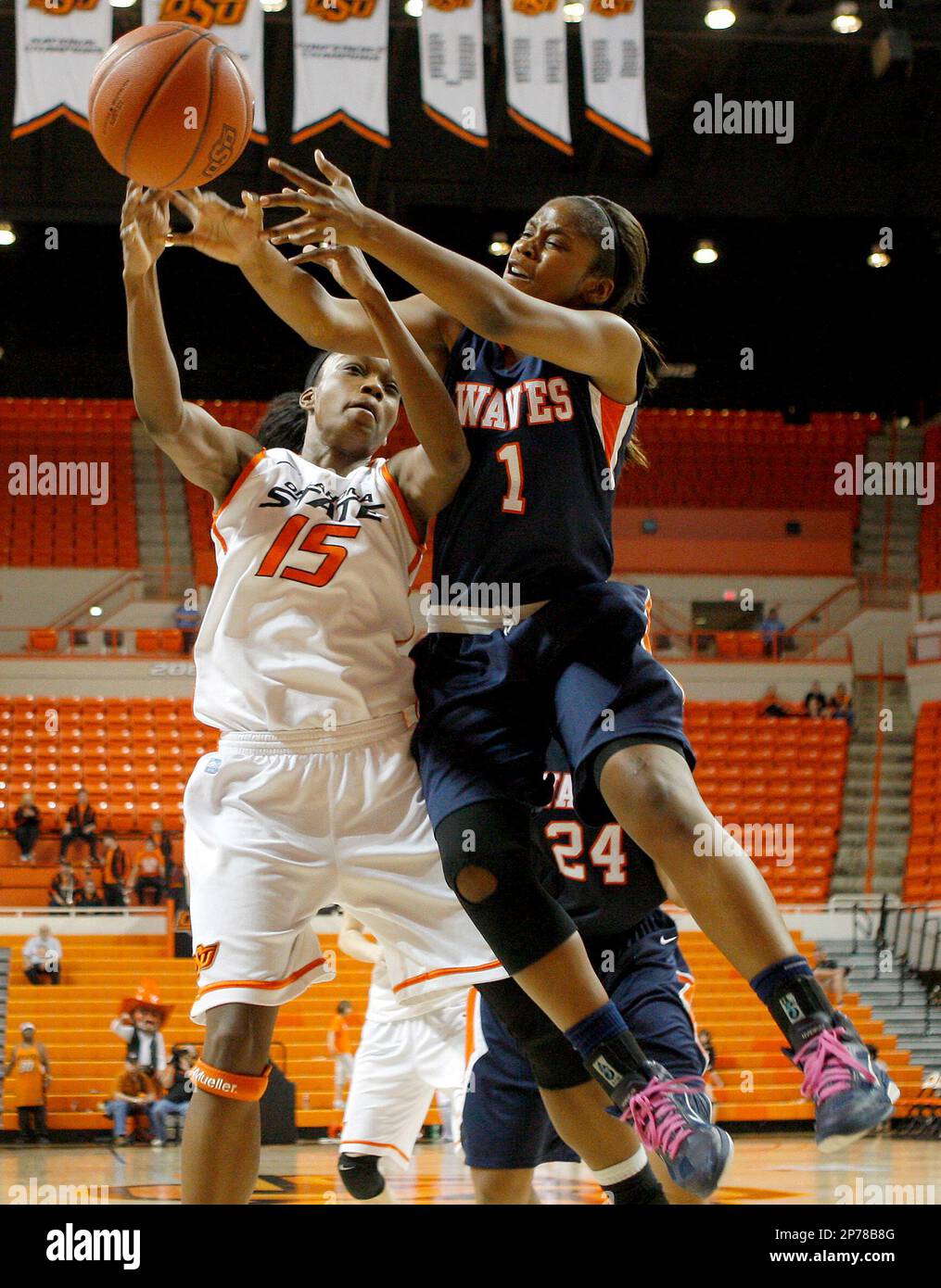 Oklahoma State's Toni Young (15) and Pepperdine's Robie Mayberry (1) go