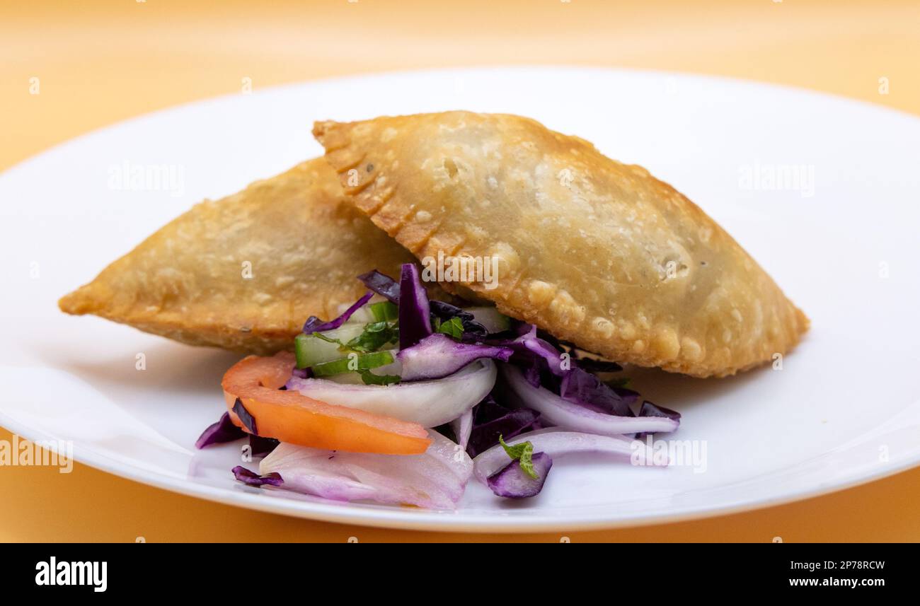 Ramadan Food Patties: Vegetarian Samosa, Veg Patty with Salad.  Spicy Indian Pakistani Snack.  Street Food Stock Photo