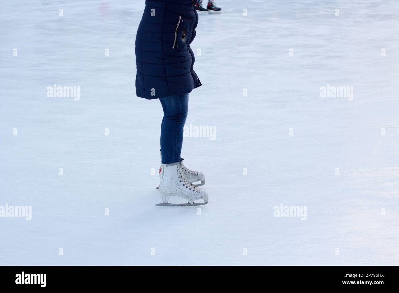 the gerl rides on ice in skates Stock Photo