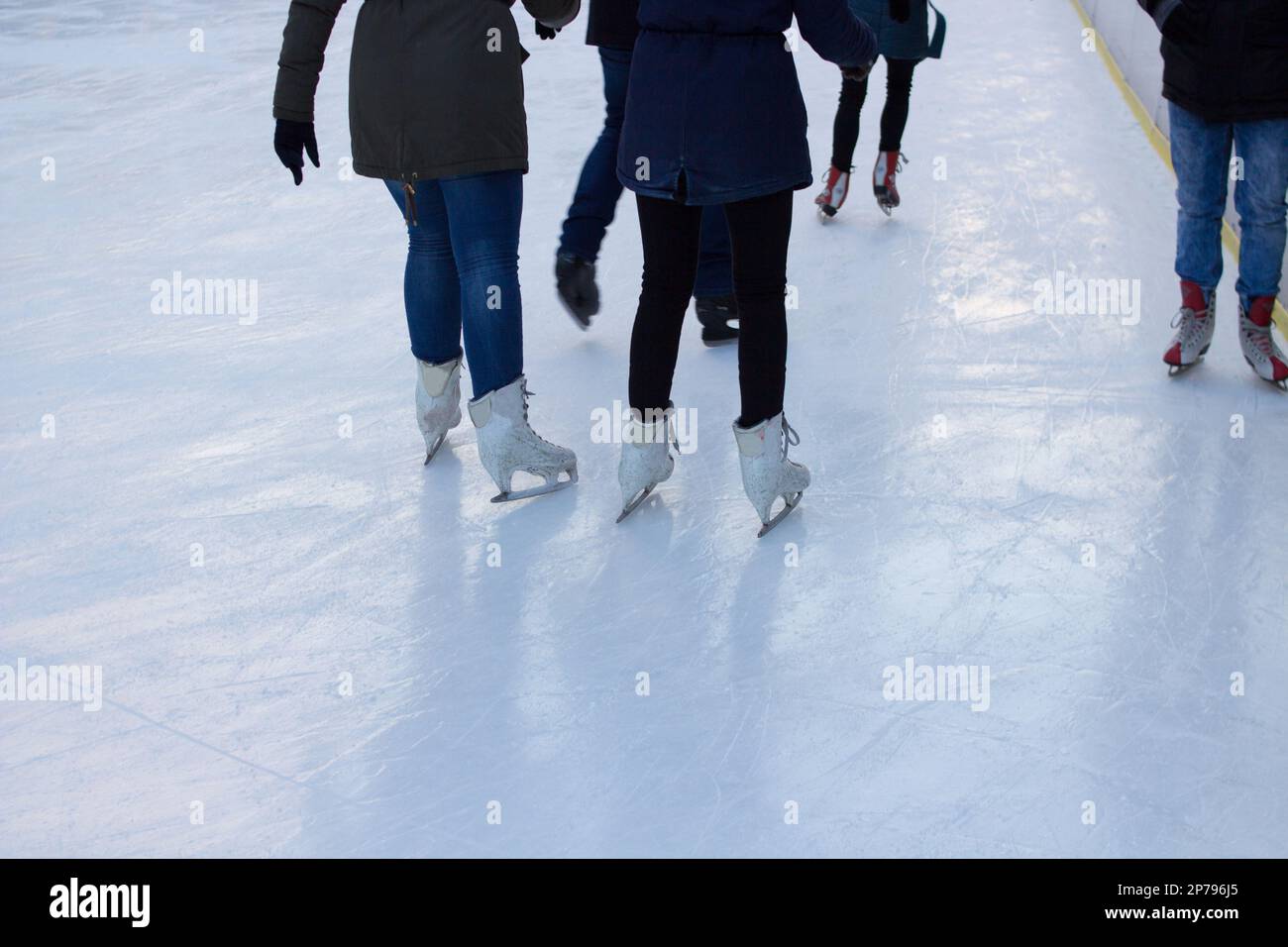 Woman ice skating. winter outdoors on ice rink. ice and legs Stock Photo