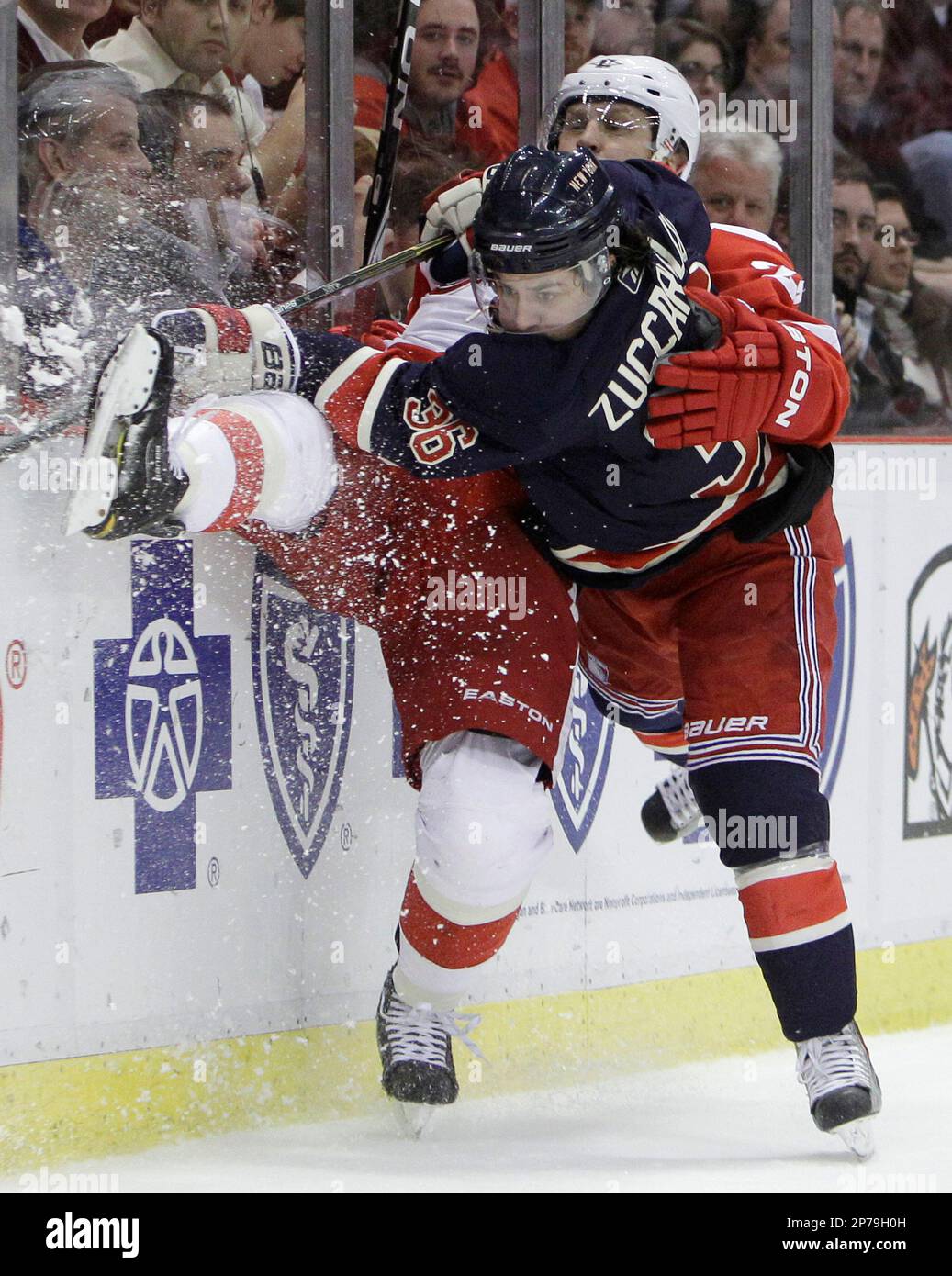 New York Rangers right wing Mats Zuccarello (36), of Norway, checks Detroit Red Wings defenseman