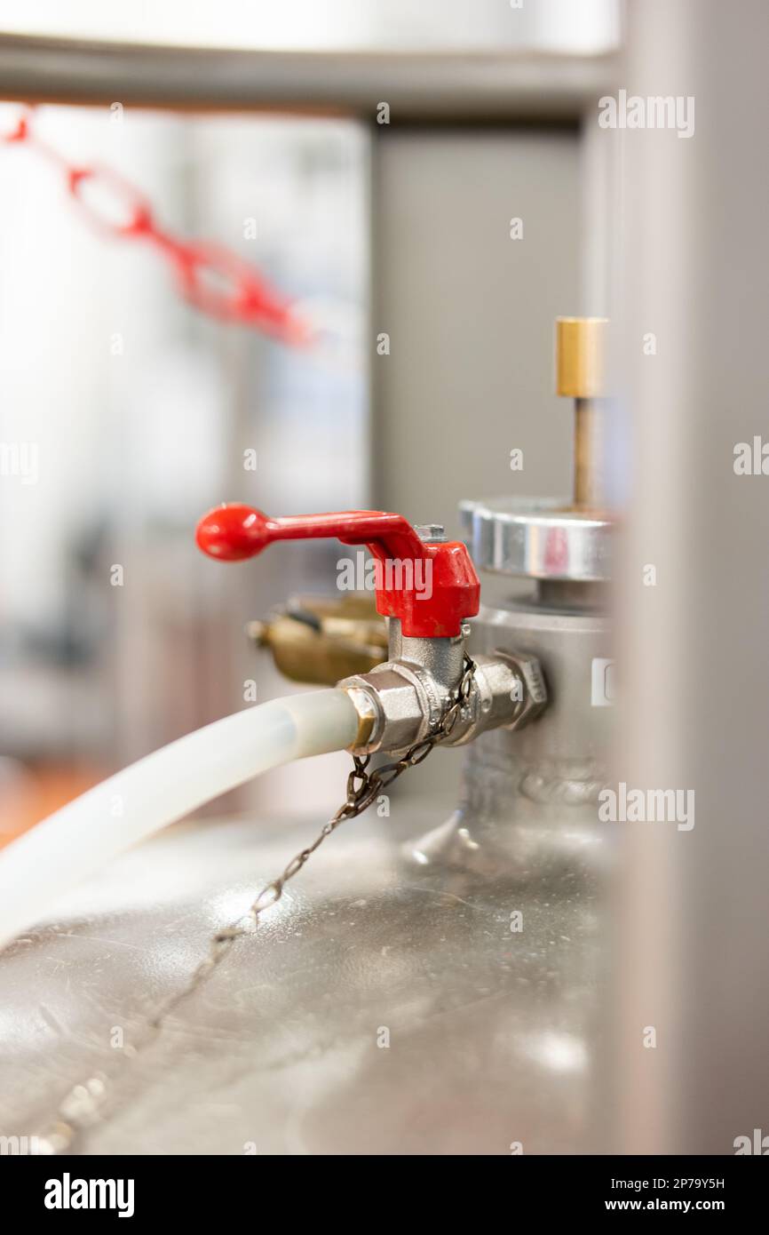 Pressurized gas tank faucet and lever close up shot isolated shallow
