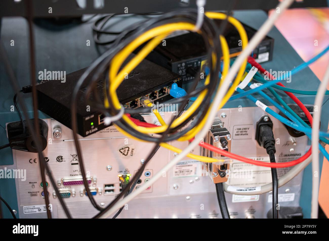 Messy connection computer and LAN cables power cord plugs. close up