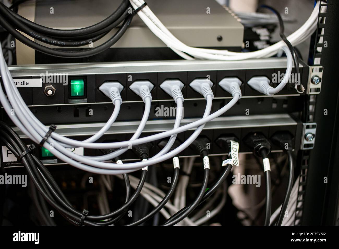 Messy connection computer and LAN cables power cord plugs. close up