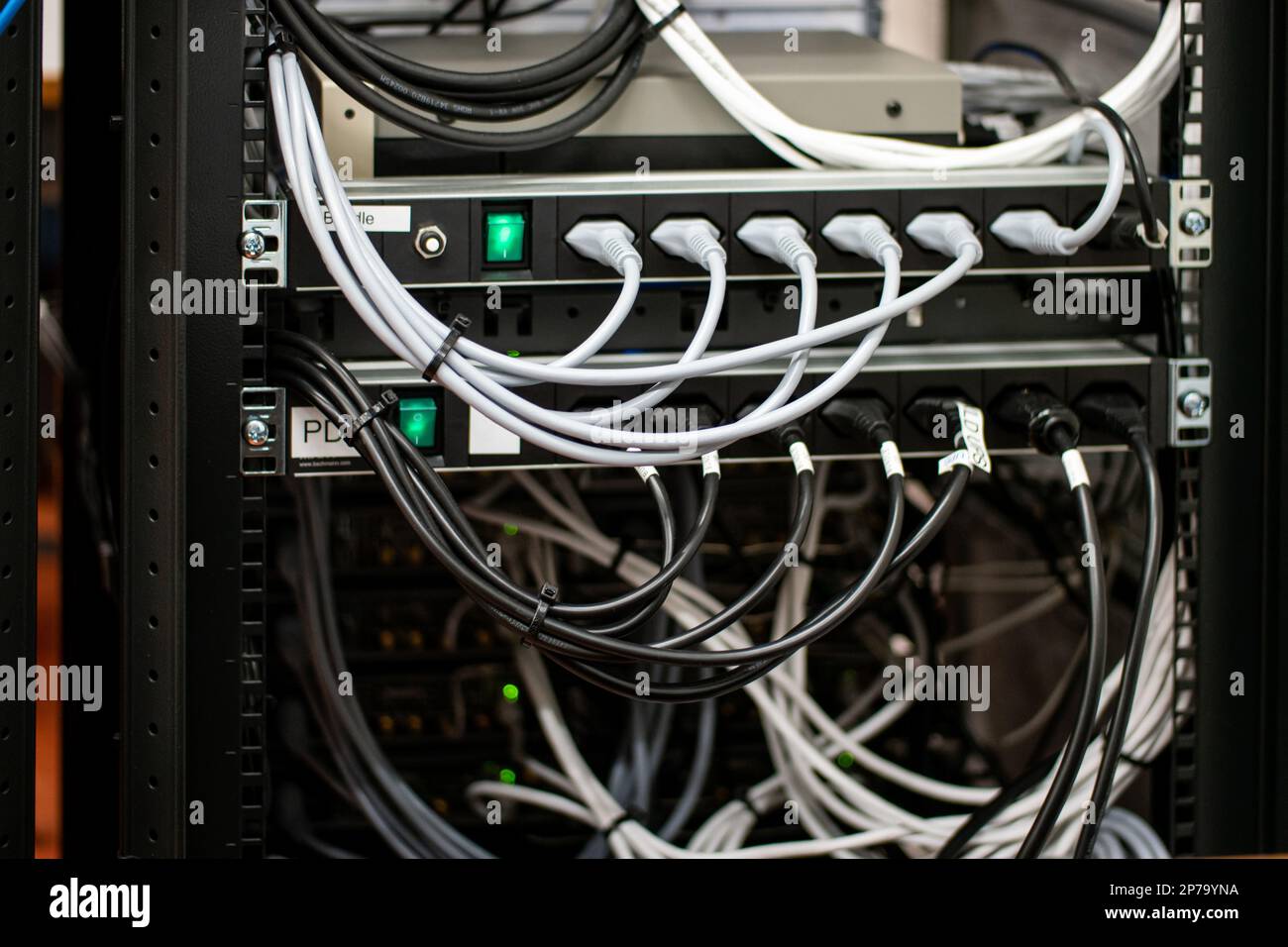 Messy connection computer and LAN cables power cord plugs. close up