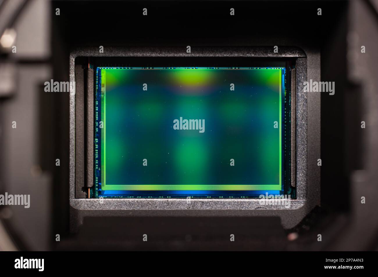Digital mirror less photography imaging sensor macro close up shot inside bayonet mount enclosure. Stock Photo