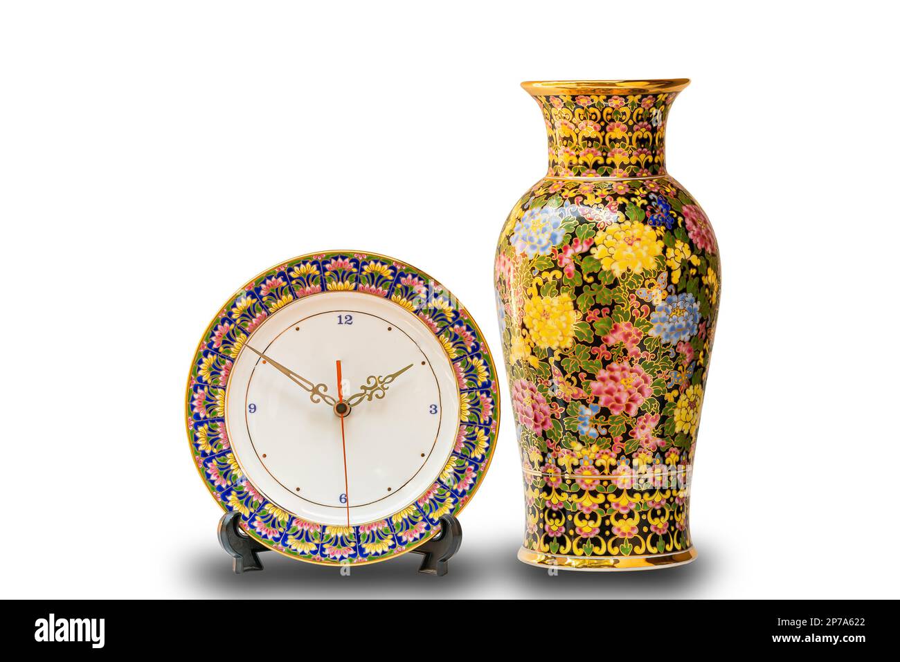 Beautiful Benjarong clock and vase on white background with clipping path. Benjarong, Thai style porcelain design in five colors. The precious Stock Photo