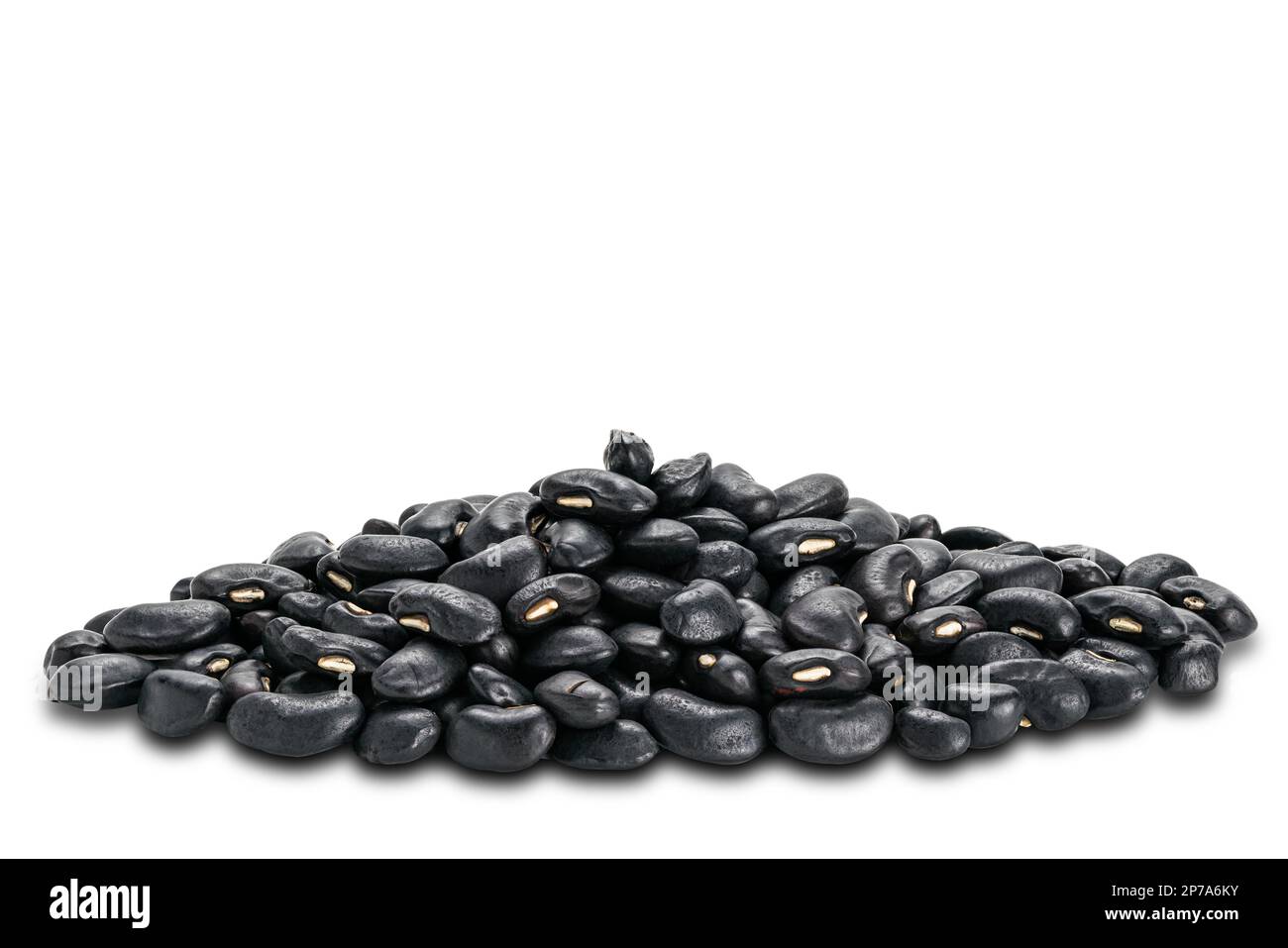 Side view closeup pile of uncooked black beans on white background with