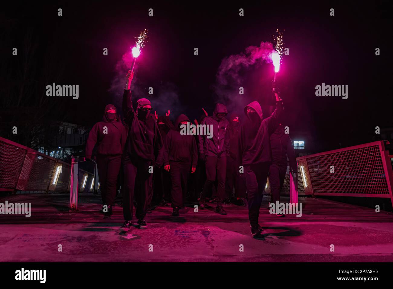 Barcelona, Spain. 08th Mar, 2023. Hooded students march to the gathering point with two flares in hand during the International Woman's Day strike. The students of the Autonomous University of Barcelona staged an 8 March strike on the occasion of International Woman's Day, blocking the entrance to the Autonomous University of Barcelona for students attending class to demand a much more feminist perspective in the education system. Credit: SOPA Images Limited/Alamy Live News Stock Photo