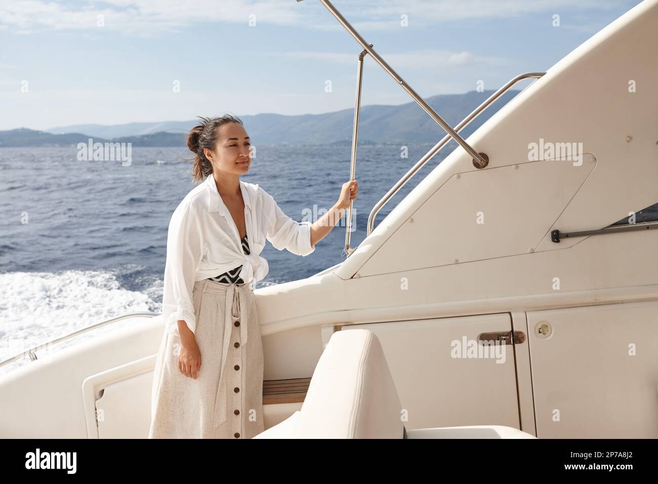 Woman on white yacht in the sea during summer vacation Stock Photo - Alamy