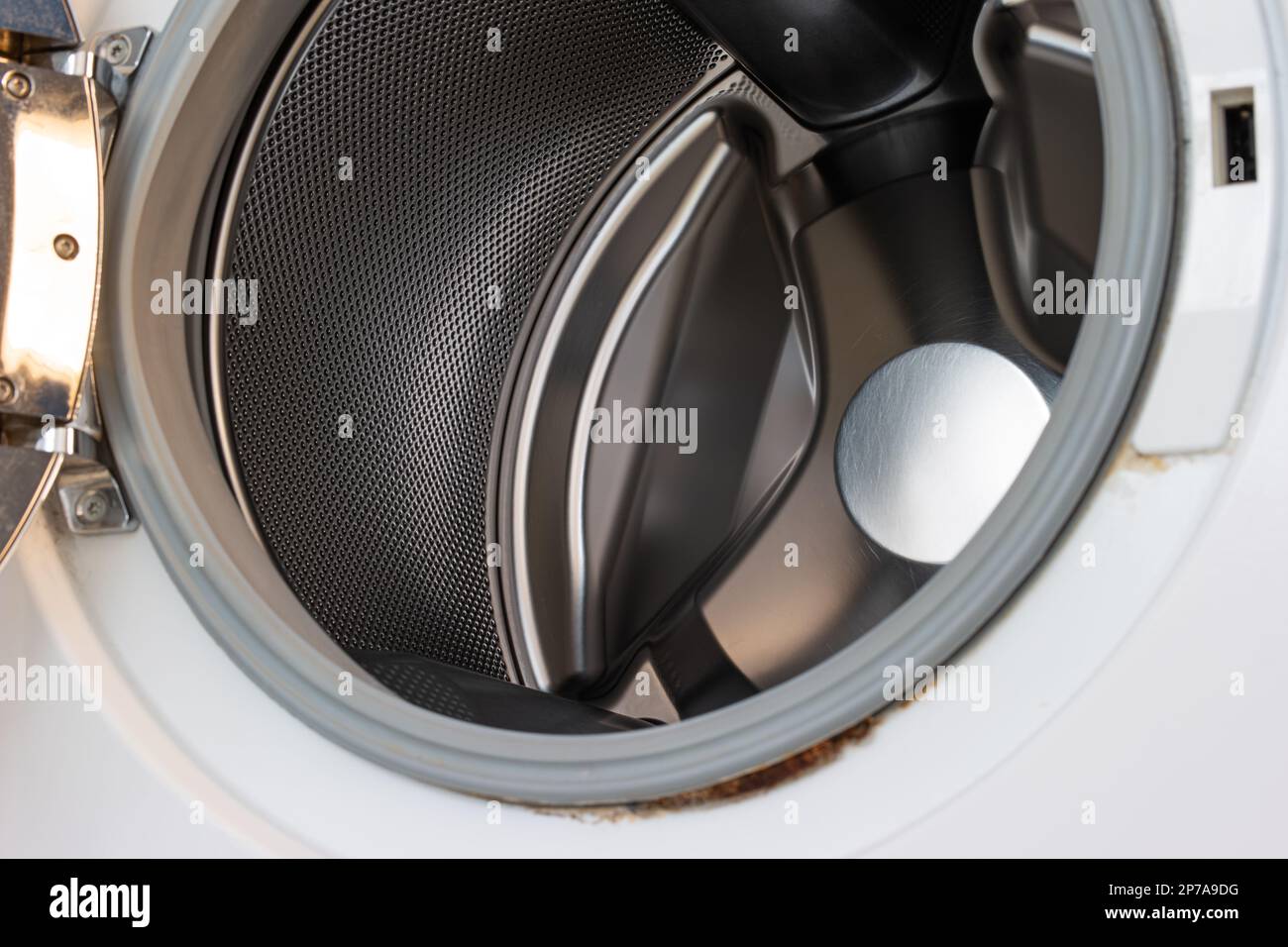 Empty washing machine loading drum close up shot, no people Stock Photo