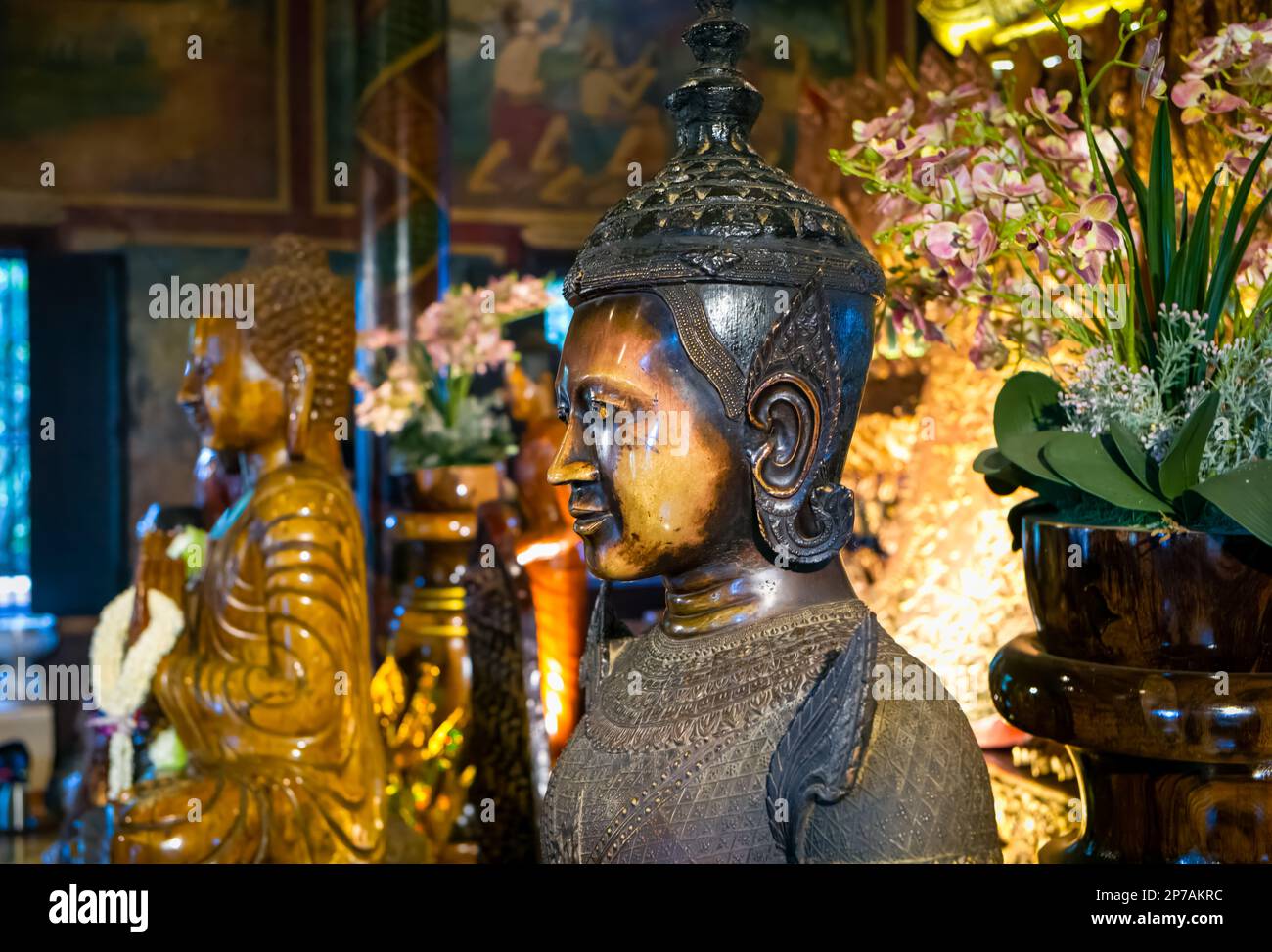 Statues within the main alter at the ancient buddhist Wat Phnom in Phnom Penh, Cambodia. Stock Photo