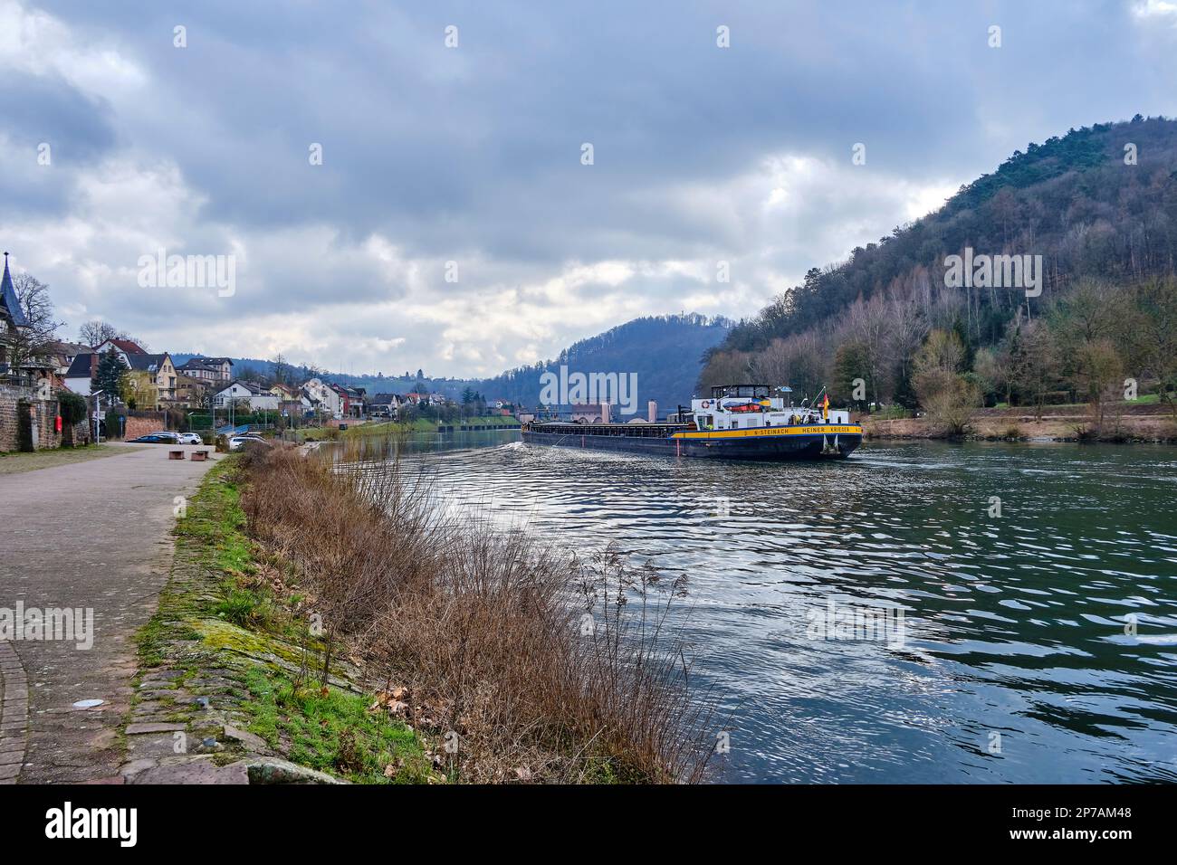 The inland freighter MS Heiner Krieger approaches the Neckarsteinach lock in Neckarsteinach, the Town of Four Castles in Hesse, Germany. Stock Photo