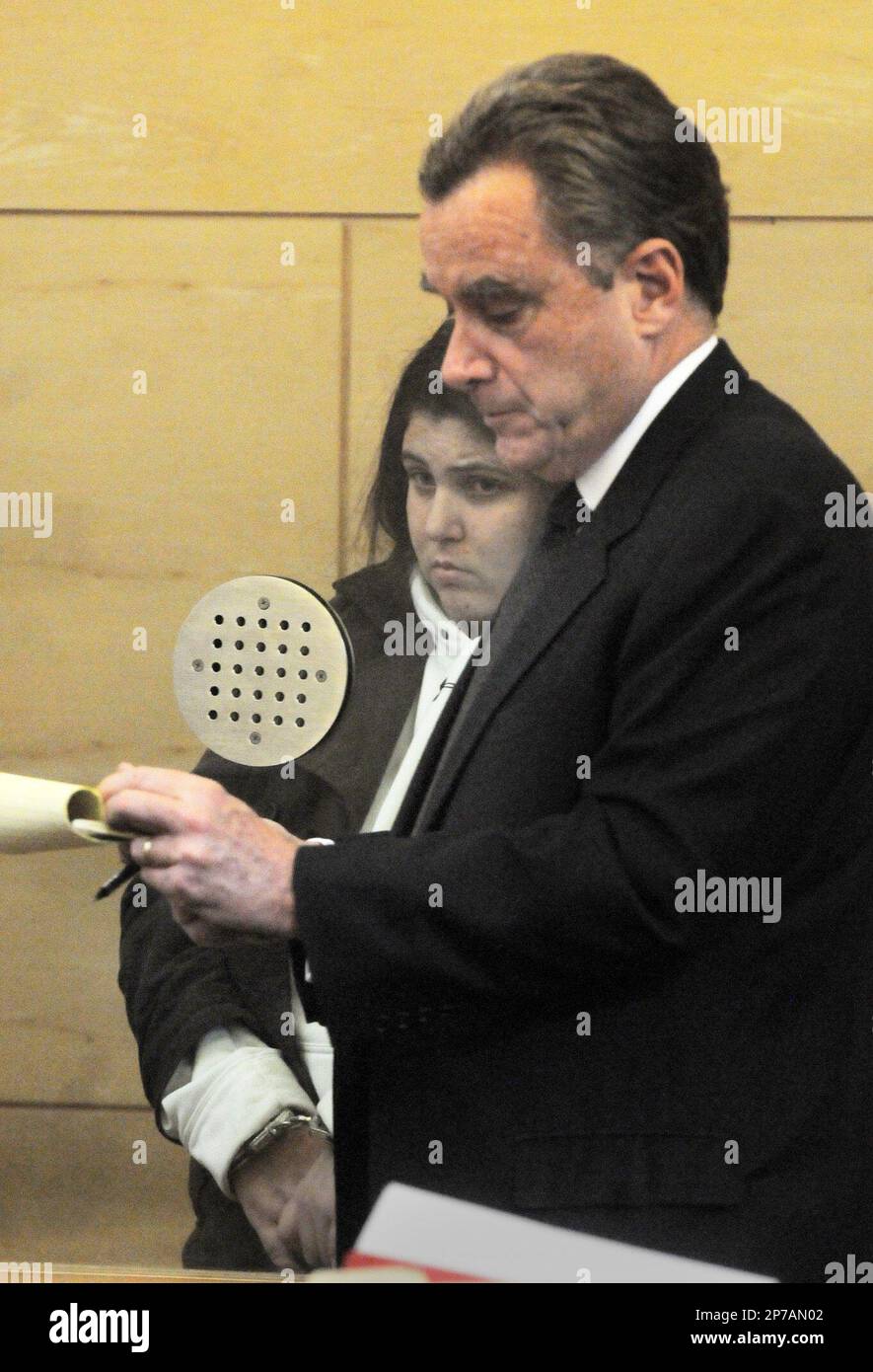 Defense Attorney James Doyle, right, represents Melissa Pfeiffer during her  arraignment on Friday, Jan. 7, 2011 in Chelsea, Mass. Pfeiffer, 26, is  accused of setting the fire inside her ground floor residence