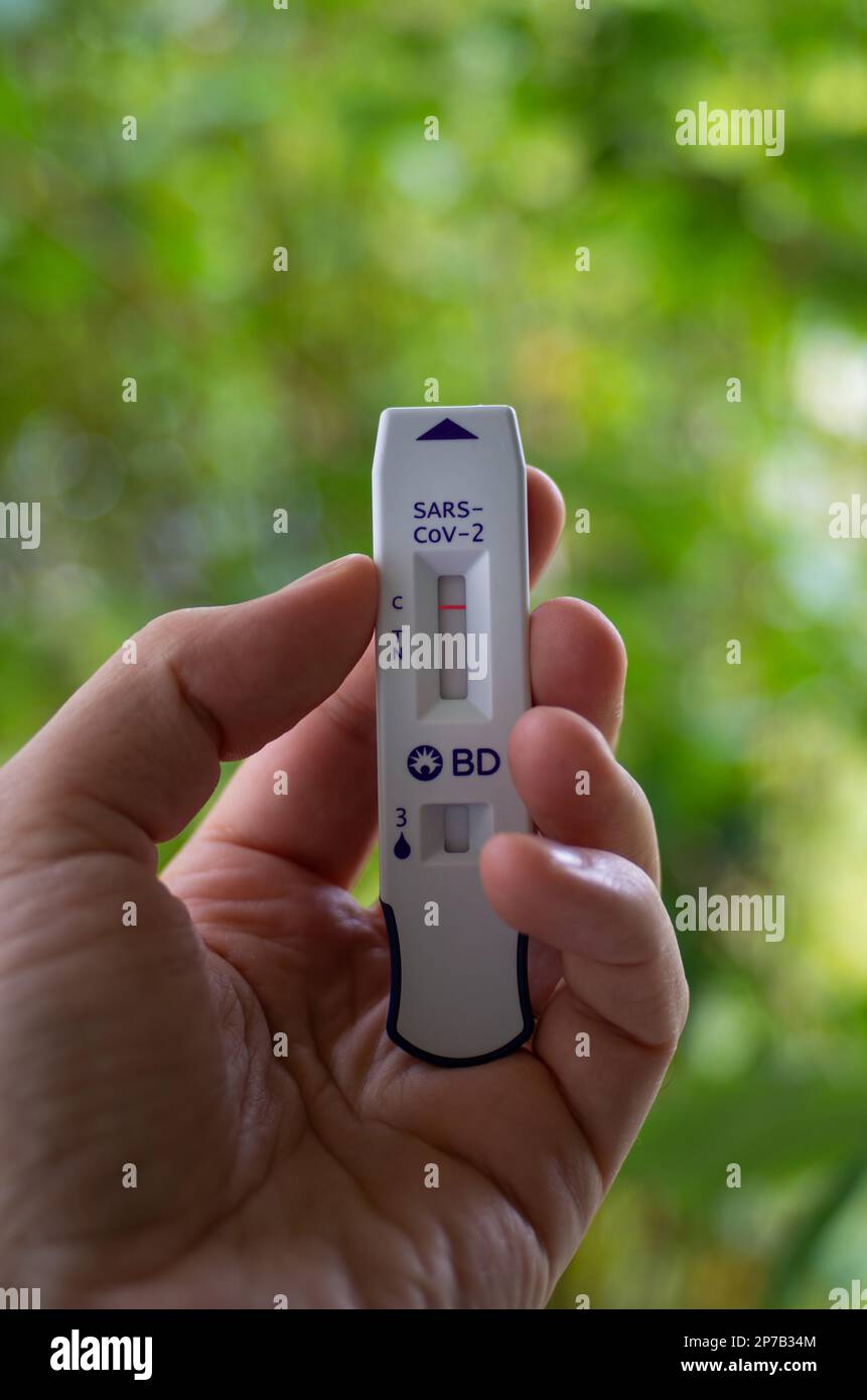 Antigen rapid Corona virus Covid 19 self test kit. Negative result, held in hand by Caucasian