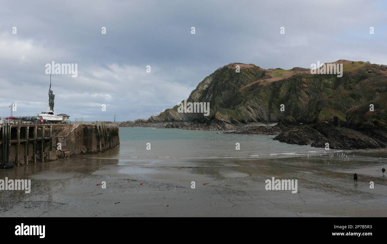 The entrance to Harbour at low tide with the statue Verity