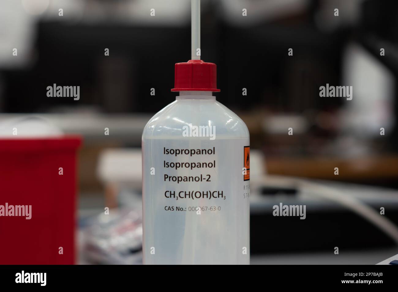 Isopropanol plastic bottle and dispenser. Close up shot in a science lab. Shallow depth of field, no people. Stock Photo