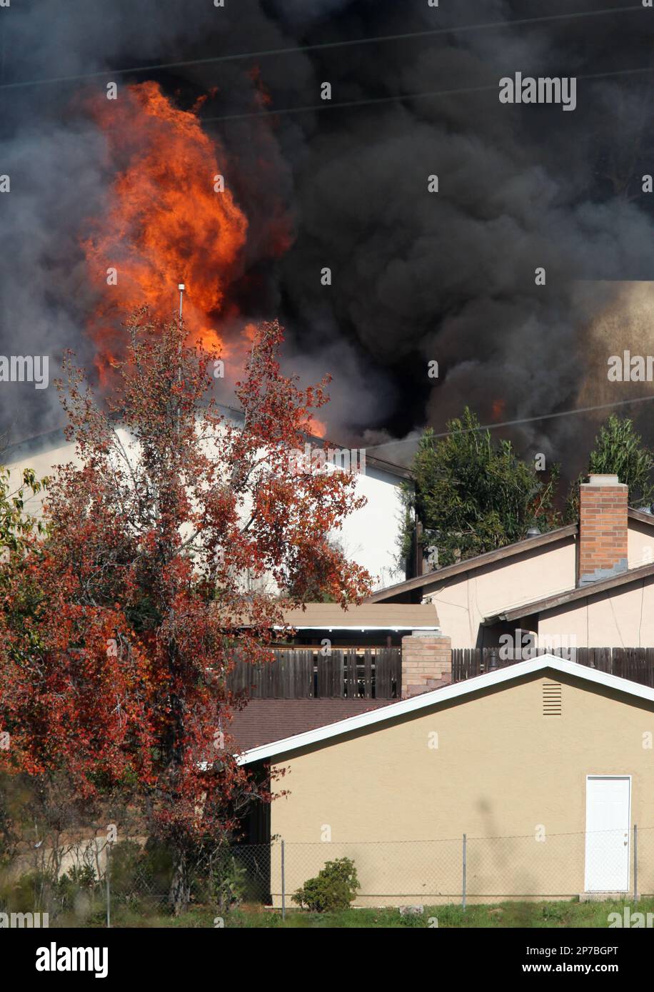 A house erupts in flames on Thursday, Dec. 9, 2010 during the 