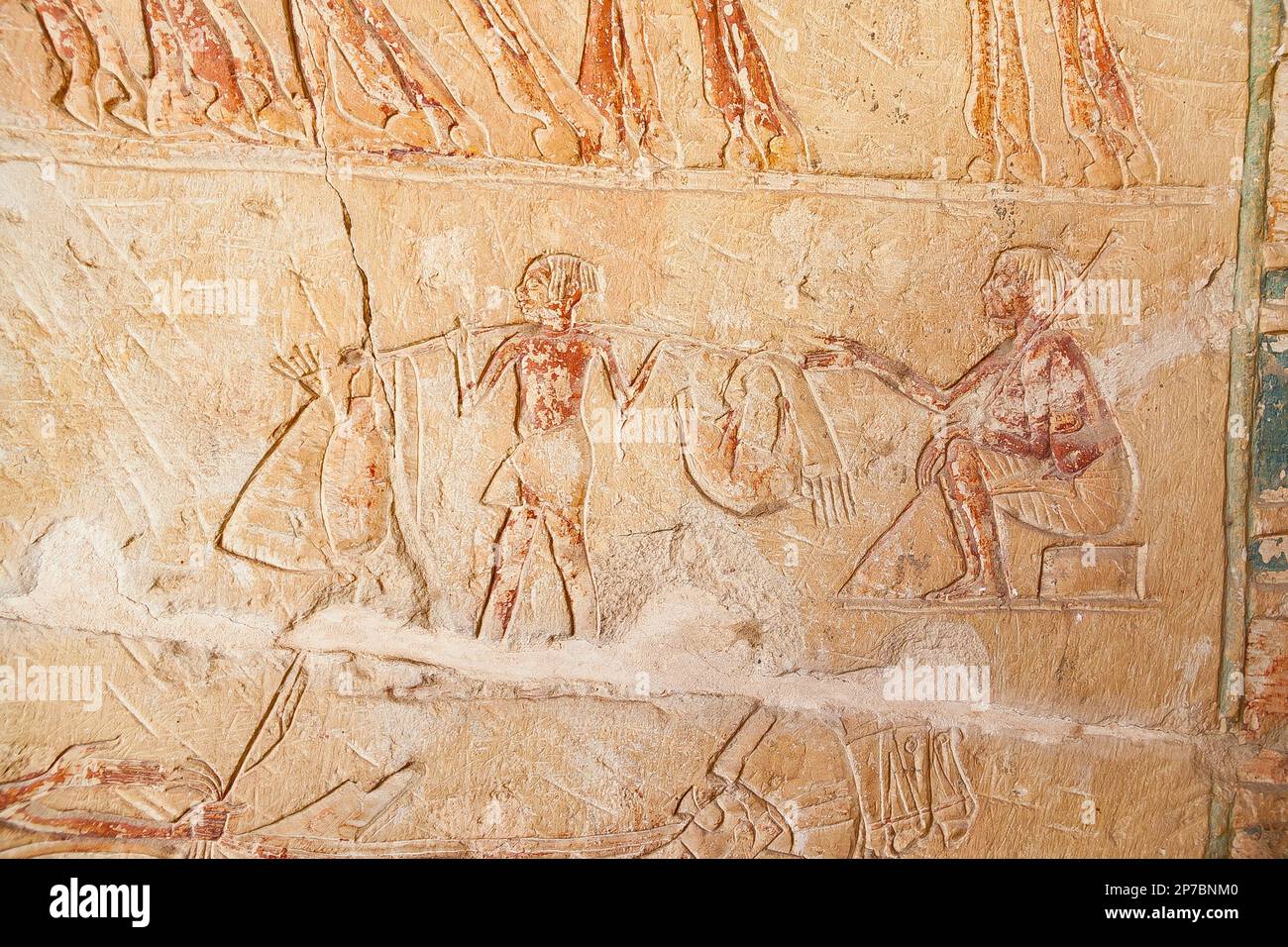 Egypt, Saqqara,  tomb of Horemheb,  inner room, East Wall South side, an officer and a servant bringing water. Stock Photo