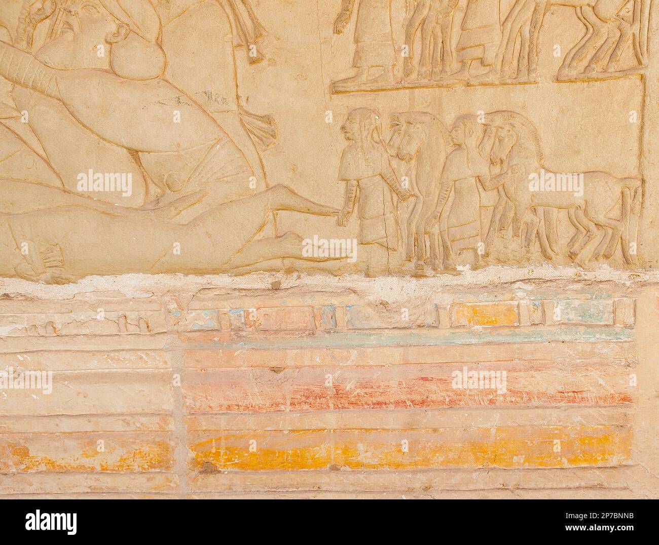 Egypt, Saqqara,  tomb of Horemheb,  west wall of the inner court, charioteers, over remains of polychromy. Stock Photo