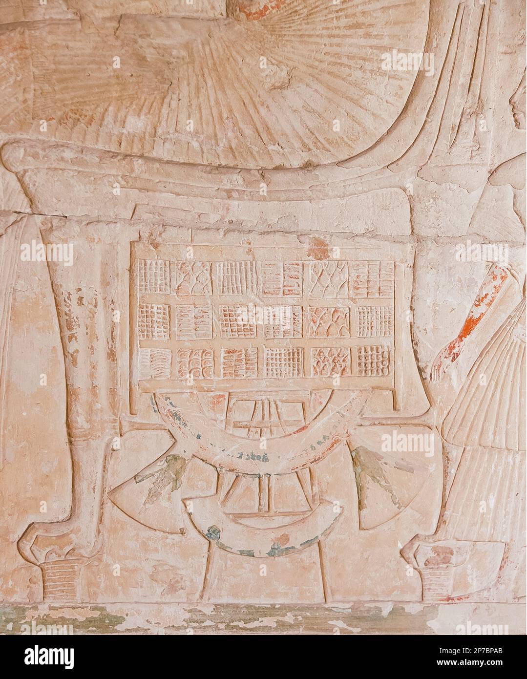 Egypt, Saqqara,  tomb of Horemheb,  inner room, South wall. Throne with lion paws, tabouret with floral motives, fruits and biscuits. Stock Photo