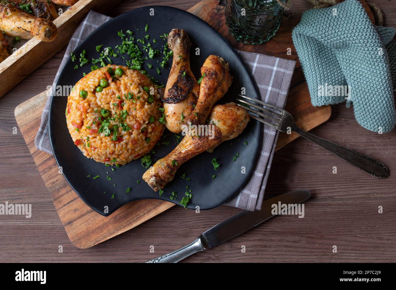 Baked chicken drumsticks with vegetable rice or serbian djuvec rice on