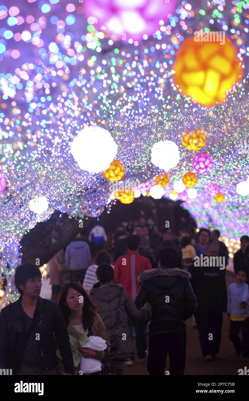 Many visitors are walking through a tunnel lit up with 3 millions of Light  Emitting Diode(LED) bulbs at Tokinosumika Illumination 2010-2011 Winter  event, Gotenba City, Shizuoka Prefecture, Nov. 12, 2010. This  year-illumination