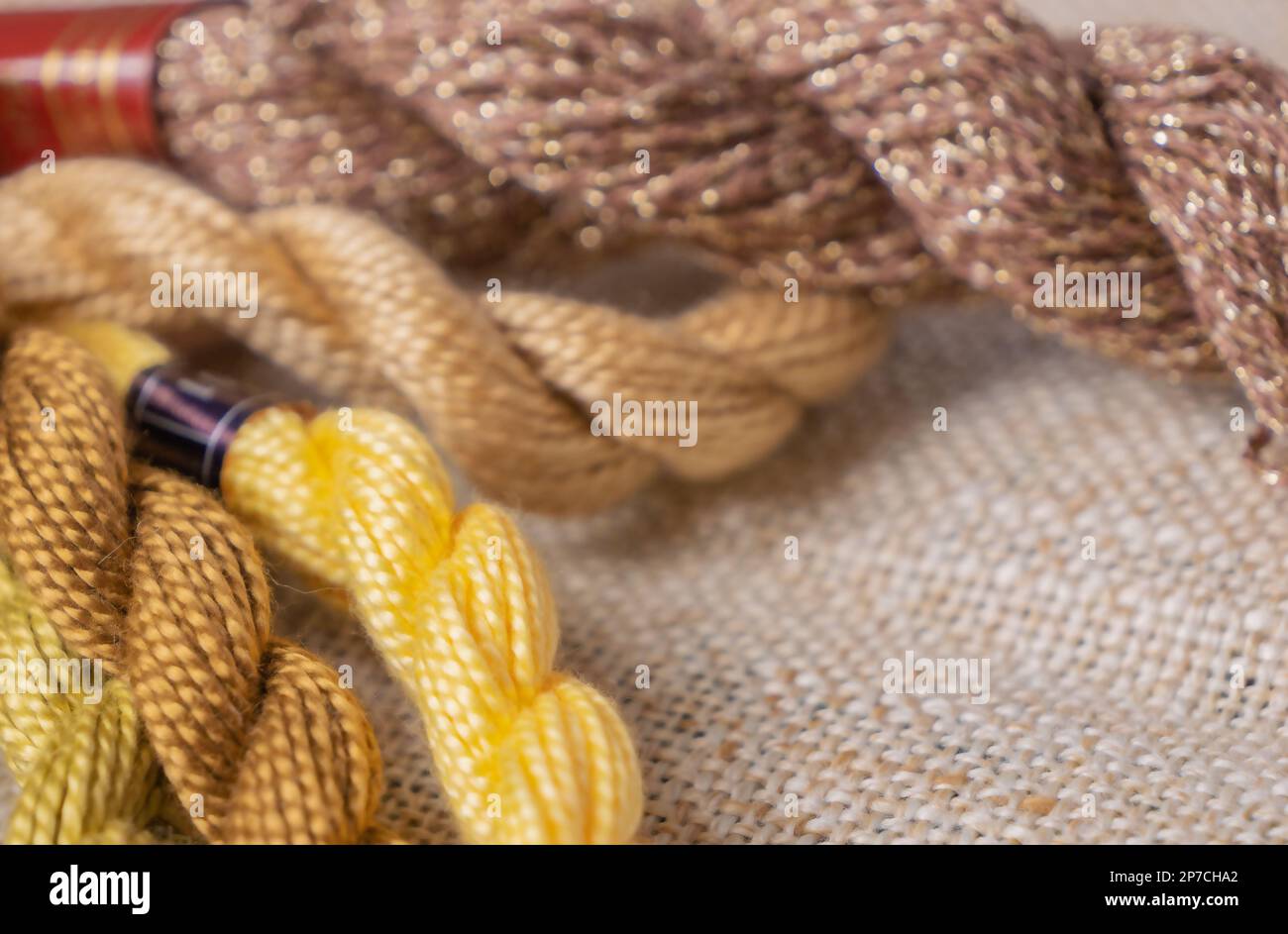 Multi-colored threads for embroidery, knitting, handmade threads, thread plaits, copy space Stock Photo